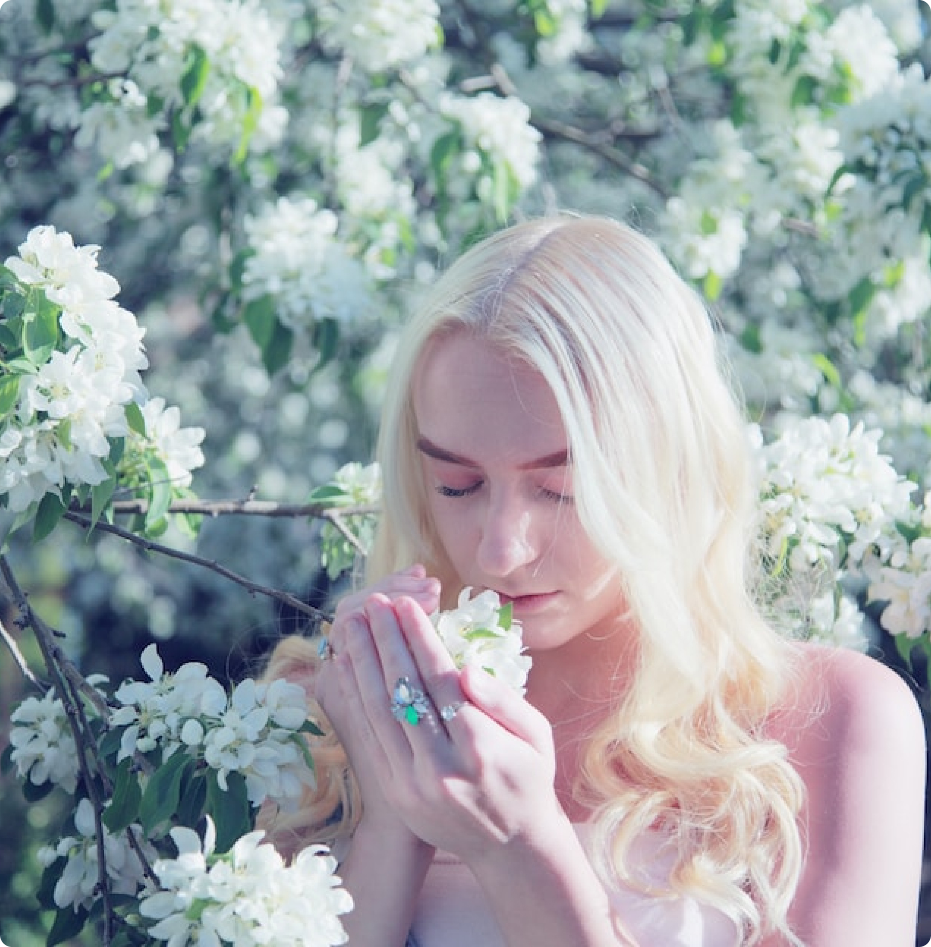 Women smelling flowers